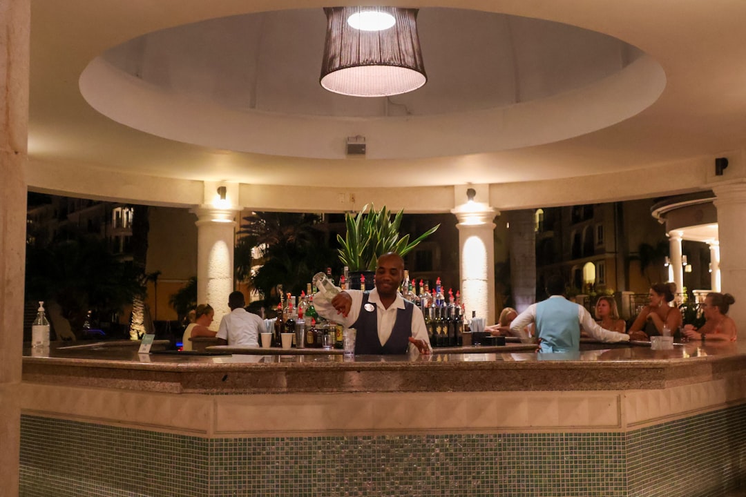 A group of people sitting at a bar