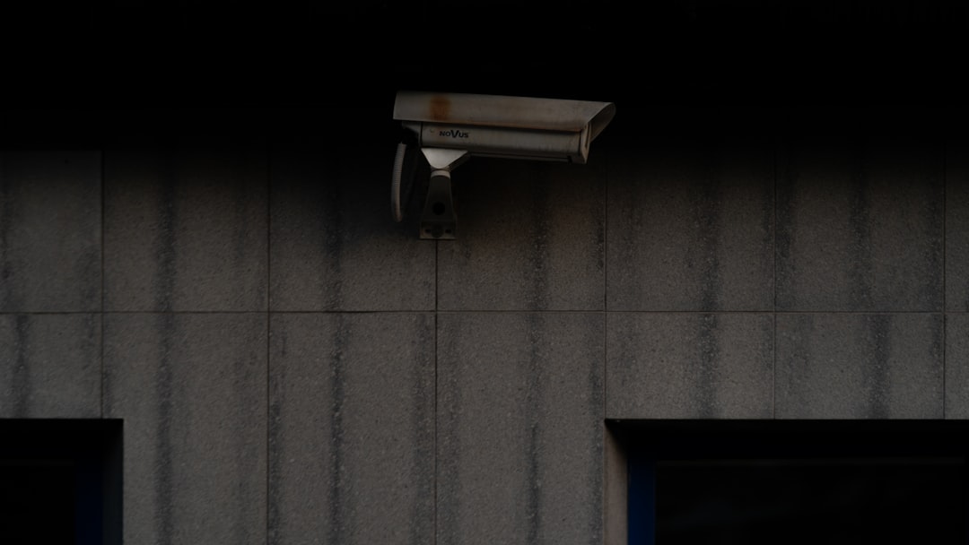 a security camera mounted to the side of a building