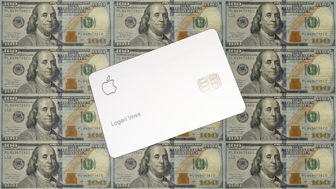 Apple card on a background of hundred dollar bills